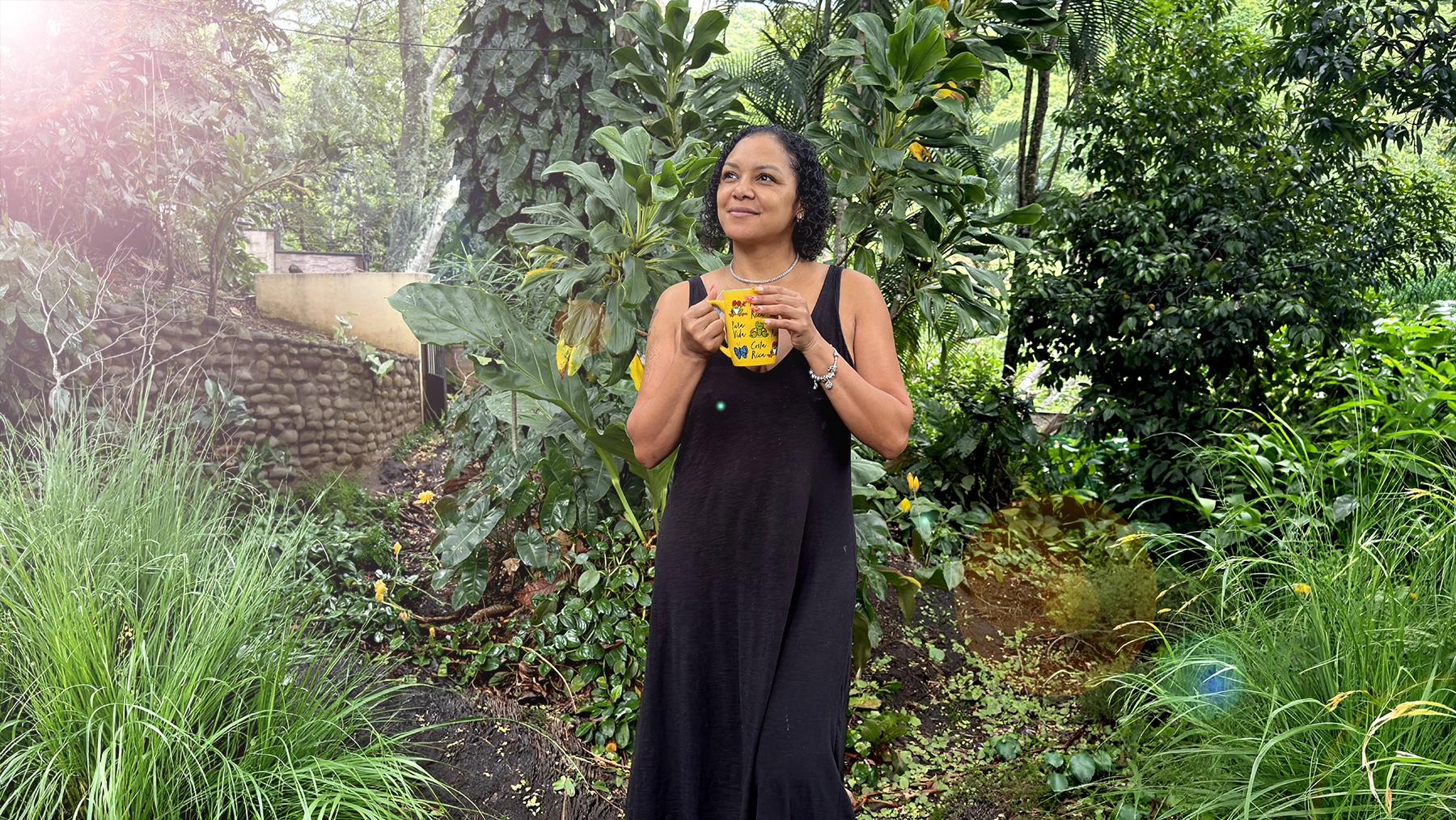 Woman standing quietly in Costa Rican nature, remembering who she is